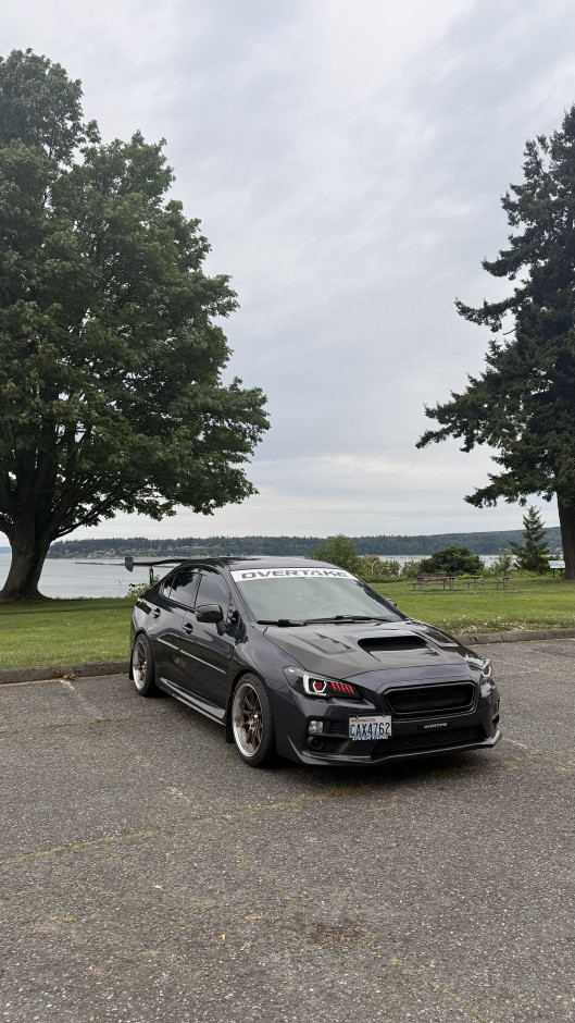 Sebastian S's 2017 WRX Upgraded Head Unit and Sound system with a carbon fiber steering wheel and carbon E-Brake